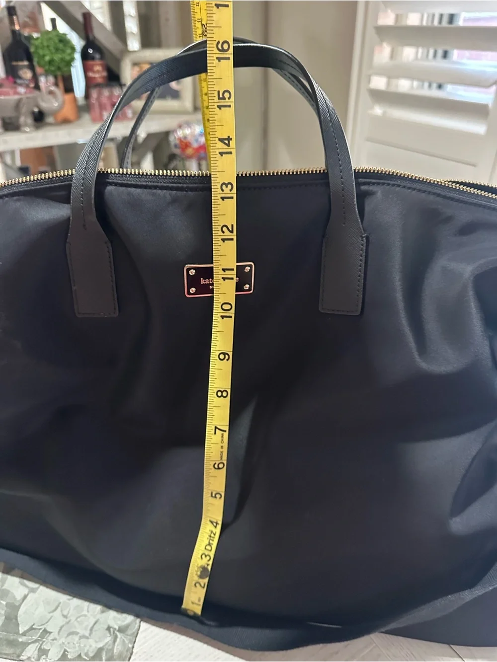 kate spade black nylon duffel with gold hardware